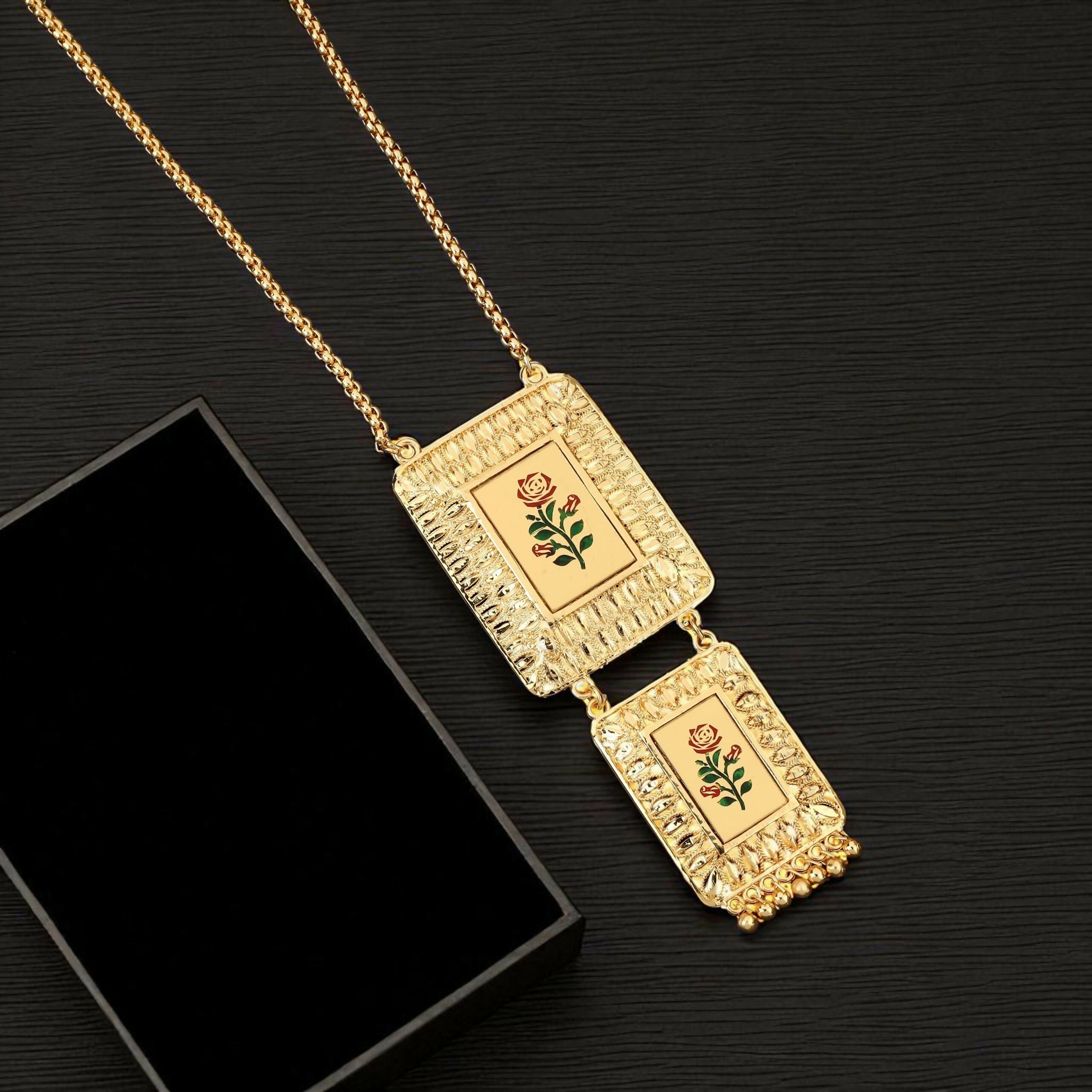Enhance your jewelry collection with this exquisite Gold-Plated Long Chain Necklace, designed to reflect timeless Indian artistry with a modern touch. Featuring a unique double-pendant design, this necklace beautifully blends traditional elegance with con