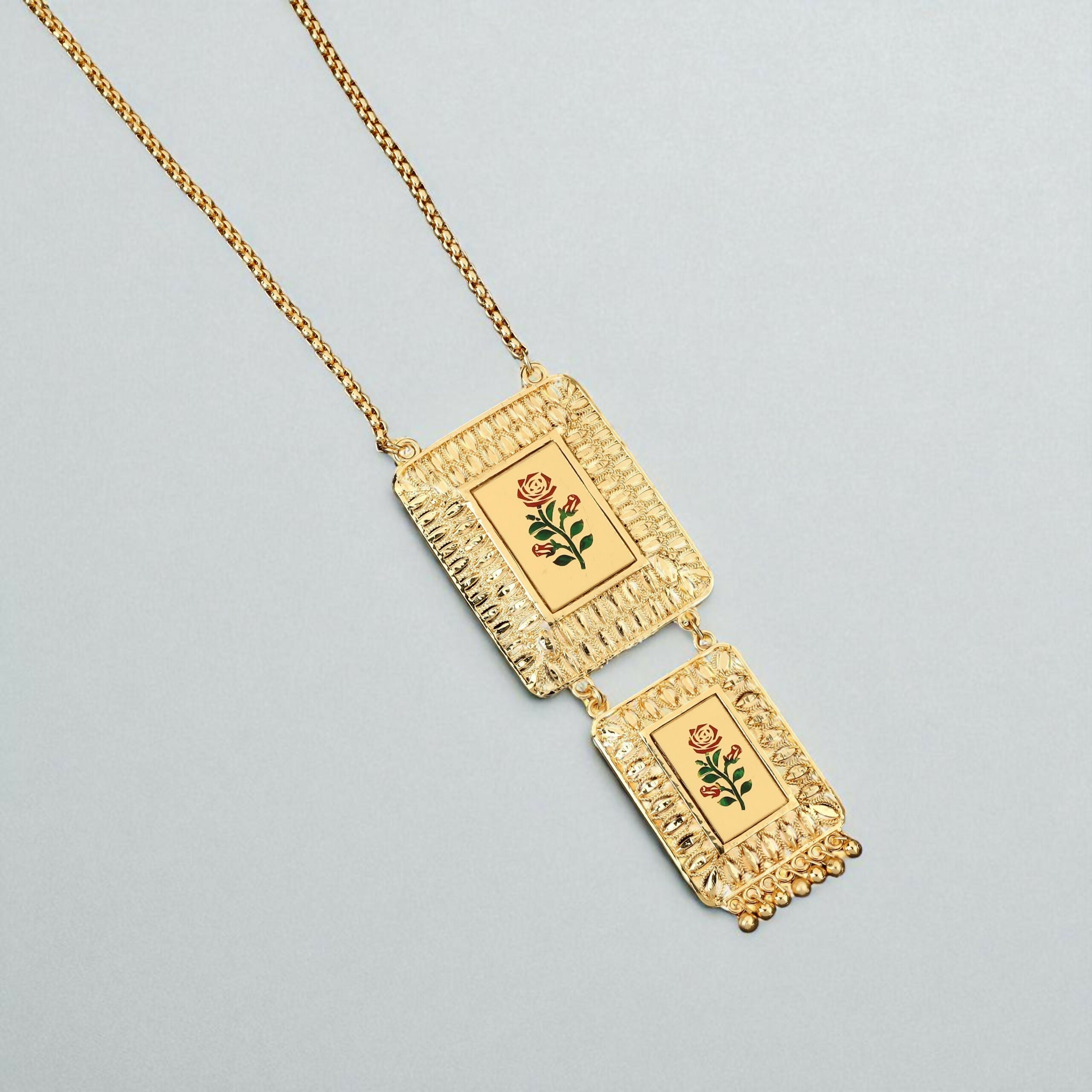 Enhance your jewelry collection with this exquisite Gold-Plated Long Chain Necklace, designed to reflect timeless Indian artistry with a modern touch. Featuring a unique double-pendant design, this necklace beautifully blends traditional elegance with con